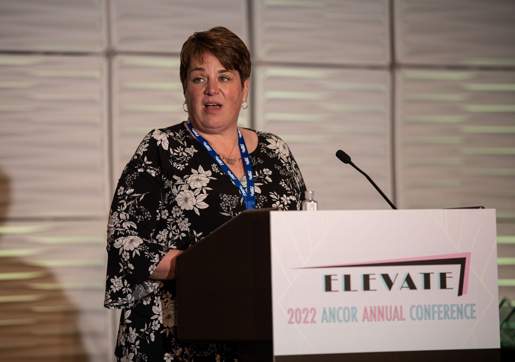ANCOR Foundation Board member speaking at a podium at the 2022 Annual Conference.